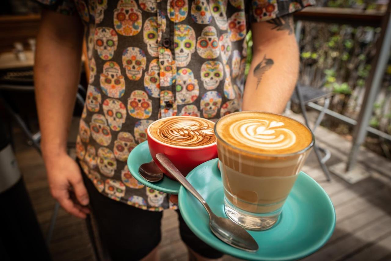 The Mansion Melbourne Hostel Exterior photo A piccolo latte (left) and a flat white (right)